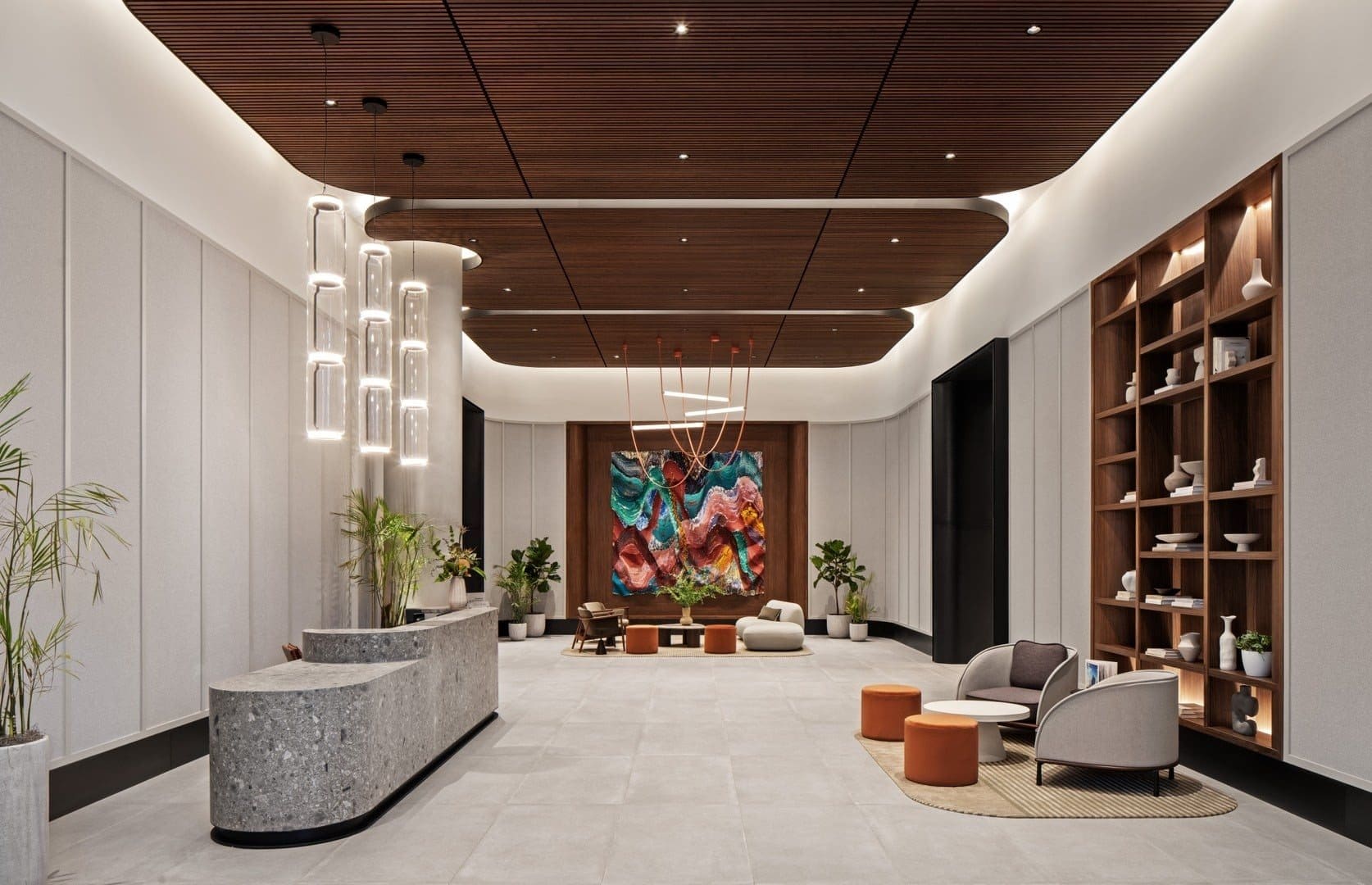 A colorful rippling silk work at the end of Linea’s lobby, beyond the reception desk and seating.